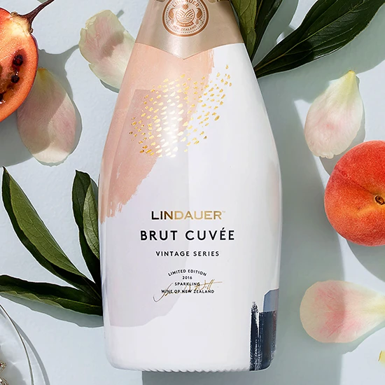 Photograph of Lindauer Brut Cuvée Wine featuring packaging illustration by Jo Tronc.