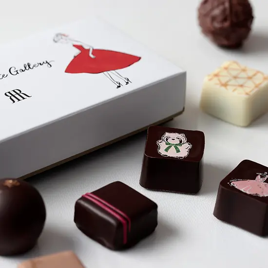 Printed chocolates and box packaging showcasing Nozomi Yuasa's creative illustrations, designed for the Rihga Royal Hotel Valentine Collection.